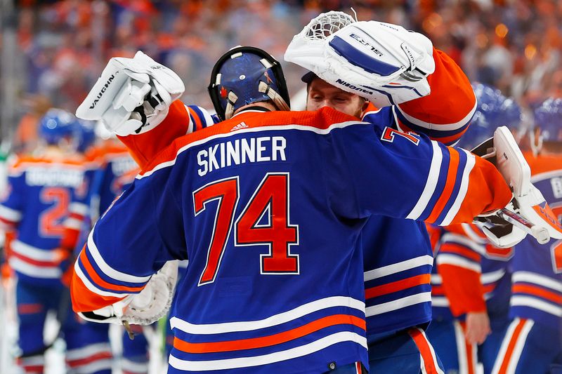 Jun 2, 2024; Edmonton, Alberta, CAN;Edmonton Oilers /74 and goaltender Calvin Pickard (30) celebrate win Ning the Western Conference Championship in game six of the Western Conference Final of the 2024 Stanley Cup Playoffs at Rogers Place. Mandatory Credit: Perry Nelson-USA TODAY Sports