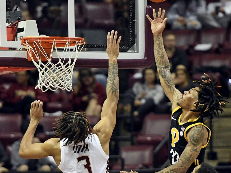 Feb 11, 2023; Tallahassee, Florida, USA; Pittsburgh Panthers guard Nike Sibande (22) shoots past Florida State Seminoles forward Cameron Corhen (3) during the second half at Donald L. Tucker Center. Mandatory Credit: Melina Myers-USA TODAY Sports