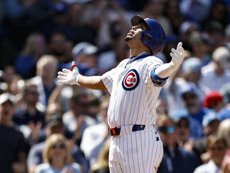 May 3, 2024; Chicago, Illinois, USA; Chicago Cubs third baseman Christopher Morel (5) celebrates as he crosses home plate after hitting a solo home run against the Milwaukee Brewers during the sixth inning at Wrigley Field. Mandatory Credit: Kamil Krzaczynski-USA TODAY Sports