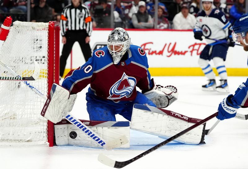 Apr 28, 2024; Denver, Colorado, USA; Colorado Avalanche goaltender Alexandar Georgiev (40) makes a save during the third period against the Winnipeg Jets in game four of the first round of the 2024 Stanley Cup Playoffs at Ball Arena. Mandatory Credit: Ron Chenoy-USA TODAY Sports