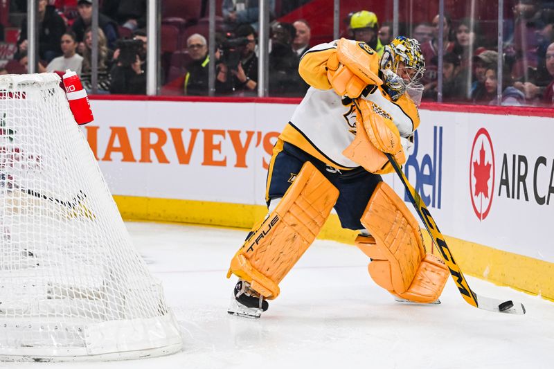 Dec 10, 2023; Montreal, Quebec, CAN; Nashville Predators goalie Juuse Saros (74) intercepts the puck behind his net against the Montreal Canadiens during the first period at Bell Centre. Mandatory Credit: David Kirouac-USA TODAY Sports