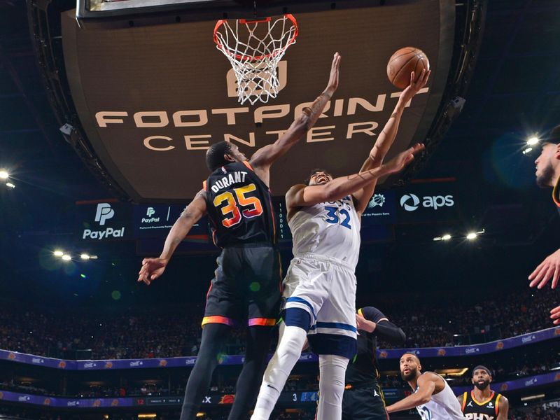 PHOENIX, AZ - APRIL  26: Karl-Anthony Towns #32 of the Minnesota Timberwolves drives to the basket during the game against the Phoenix Suns on April 26, 2024 at Footprint Center in Phoenix, Arizona. NOTE TO USER: User expressly acknowledges and agrees that, by downloading and or using this photograph, user is consenting to the terms and conditions of the Getty Images License Agreement. Mandatory Copyright Notice: Copyright 2024 NBAE (Photo by Kate Frese/NBAE via Getty Images)