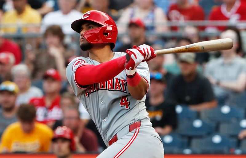 Jun 18, 2024; Pittsburgh, Pennsylvania, USA;  Cincinnati Reds third baseman Santiago Espinal (4) hits a two run home run against the Pittsburgh Pirates during the fifth inning at PNC Park. Mandatory Credit: Charles LeClaire-USA TODAY Sports