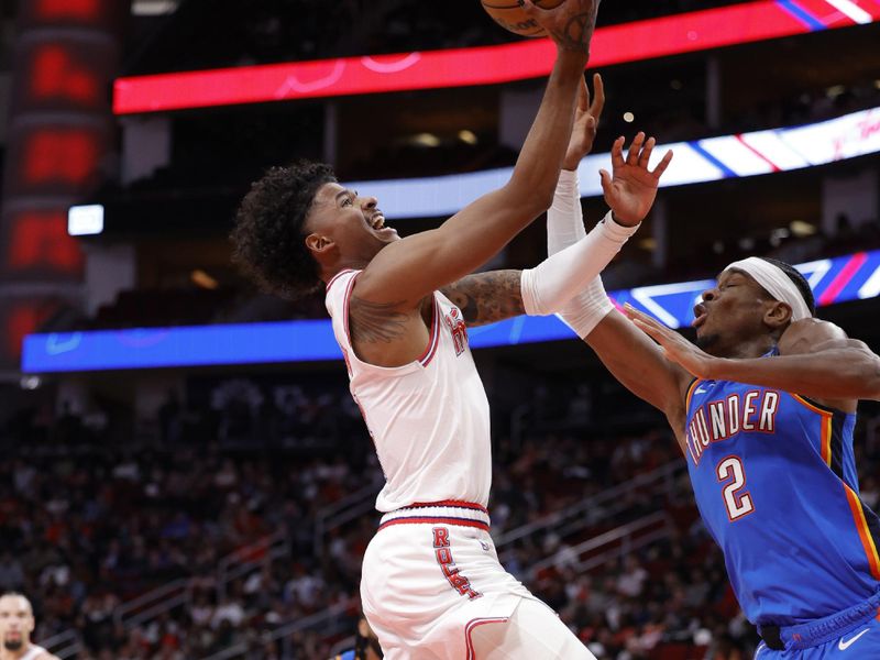 HOUSTON, TEXAS - DECEMBER 06: Jalen Green #4 of the Houston Rockets drives to the net against Shai Gilgeous-Alexander #2 of the Oklahoma City Thunder during the second half at Toyota Center on December 06, 2023 in Houston, Texas. NOTE TO USER: User expressly acknowledges and agrees that, by downloading and or using this photograph, User is consenting to the terms and conditions of the Getty Images License Agreement.? (Photo by Carmen Mandato/Getty Images)