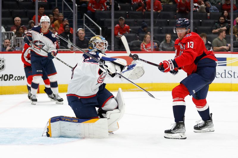 Sep 27, 2024; Washington, District of Columbia, USA; Columbus Blue Jackets goaltender Pavel Cajan (30) makes a save on Washington Capitals forward Jakob Vrana (13) in the third period at Capital One Arena. Mandatory Credit: Geoff Burke-Imagn Images