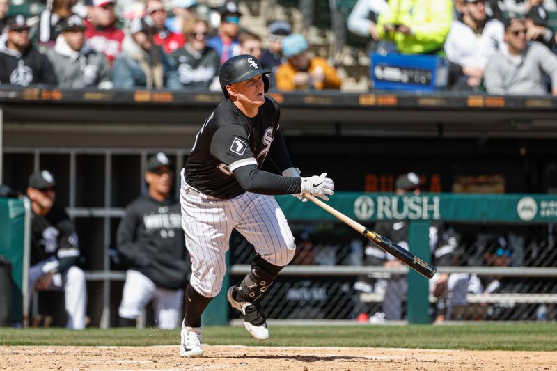 Apr 6, 2023; Chicago, Illinois, USA; Chicago White Sox first baseman Andrew Vaughn (25) hits an RBI single against the San Francisco Giants during the fourth inning at Guaranteed Rate Field. Mandatory Credit: Kamil Krzaczynski-USA TODAY Sports