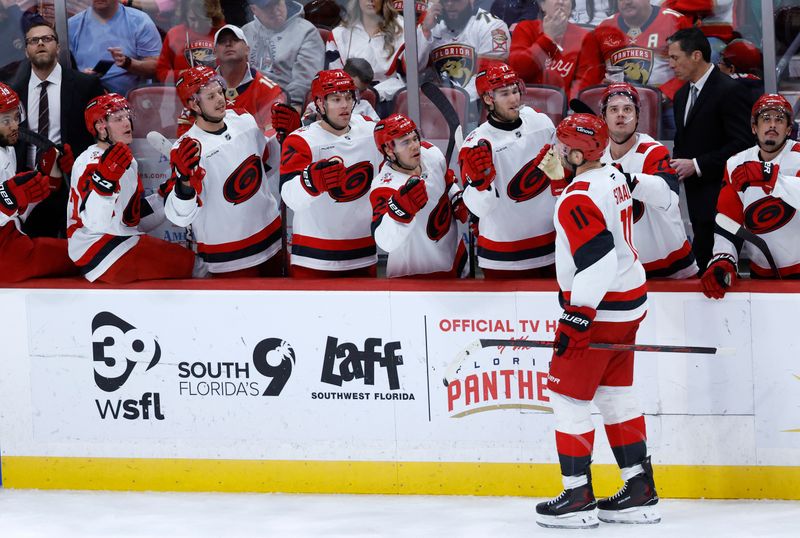 Dec 19, 2025; Sunrise, Florida, USA;  Carolina Hurricanes center Jordan Staal (11) celebrates his goal with teammates against the Florida Panthers during the first period at Amerant Bank Arena. Mandatory Credit: Rhona Wise-Imagn Images