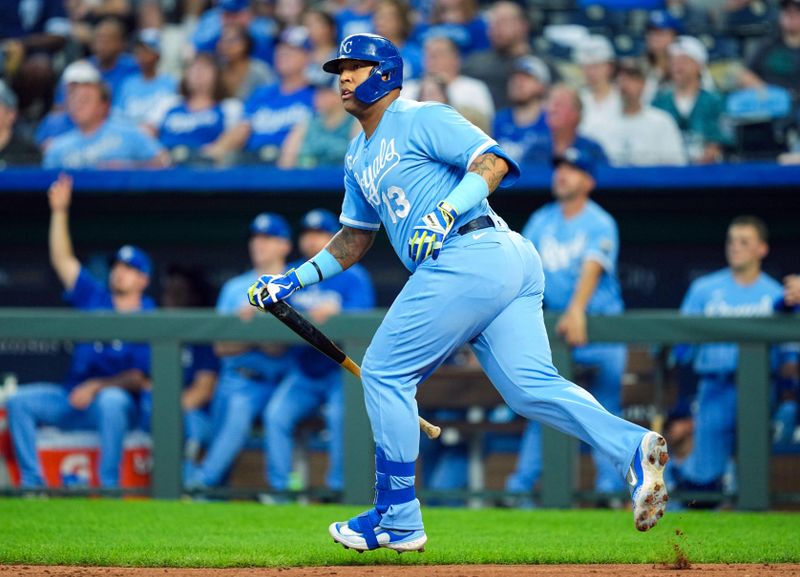 Sep 30, 2023; Kansas City, Missouri, USA; Kansas City Royals designated hitter Salvador Perez (13) watches after hitting a home run during the third inning against the New York Yankees at Kauffman Stadium. Mandatory Credit: Jay Biggerstaff-USA TODAY Sports