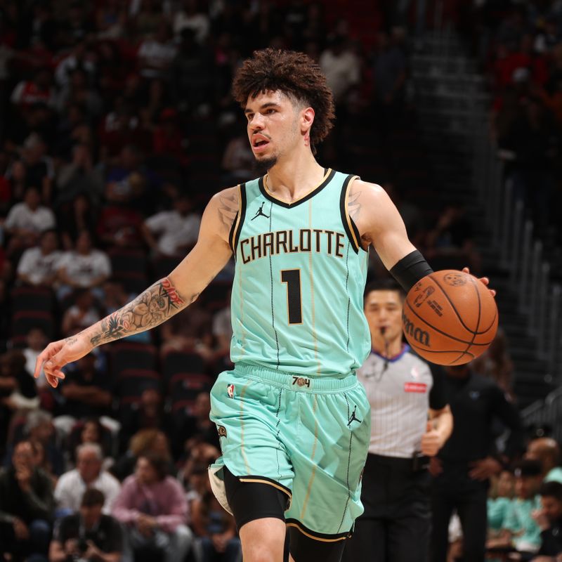 MIAMI, FL - March 23:  LaMelo Ball #1 of the Charlotte Hornets dribbles the ball during the game against the Miami Heat on March 23, 2025 at Kaseya Center in Miami, Florida. NOTE TO USER: User expressly acknowledges and agrees that, by downloading and or using this Photograph, user is consenting to the terms and conditions of the Getty Images License Agreement. Mandatory Copyright Notice: Copyright 2025 NBAE (Photo by Issac Baldizon/NBAE via Getty Images)