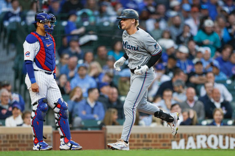 May 14, 2025; Chicago, Illinois, USA; Miami Marlins center fielder Kyle Stowers (28) crosses home plate after hitting a solo home run against the Chicago Cubs during the fourth inning at Wrigley Field. Mandatory Credit: Kamil Krzaczynski-Imagn Images
