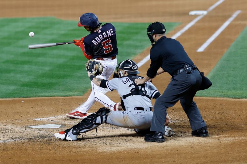 Sep 18, 2023; Washington, District of Columbia, USA; Washington Nationals shortstop CJ Abrams (5) hits a double against the Chicago White Sox during the eighth inning at Nationals Park. Mandatory Credit: Geoff Burke-USA TODAY Sports