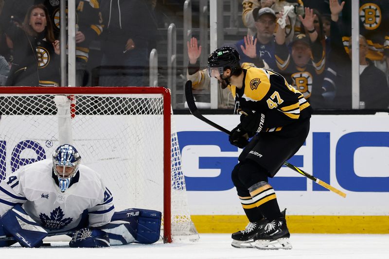 Oct 26, 2024; Boston, Massachusetts, USA; Boston Bruins center Mark Kastelic (47) celebrates his goal next to Toronto Maple Leafs goaltender Anthony Stolarz (41) during the second period at TD Garden. Mandatory Credit: Winslow Townson-Imagn Images