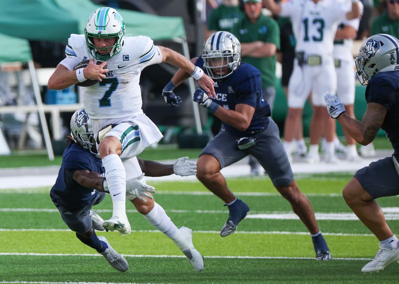 Oct 28, 2023; Houston, Texas, USA; Tulane Green Wave quarterback Michael Pratt (7) rushes for a first down against the Tulane Green Wave in the first half at Rice Stadium. Mandatory Credit: Thomas Shea-USA TODAY Sports