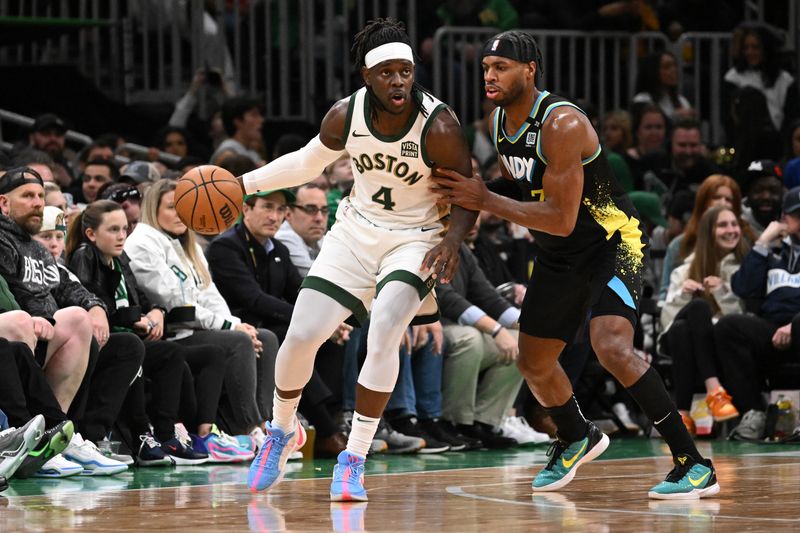 BOSTON, MASSACHUSETTS - JANUARY 30: Jrue Holiday #4 of the Boston Celtics posts up against Buddy Hield #7 of the Indiana Pacers during the second quarter at the TD Garden on January 30, 2024 in Boston, Massachusetts. NOTE TO USER: User expressly acknowledges and agrees that, by downloading and or using this photograph, User is consenting to the terms and conditions of the Getty Images License Agreement. (Photo by Brian Fluharty/Getty Images)