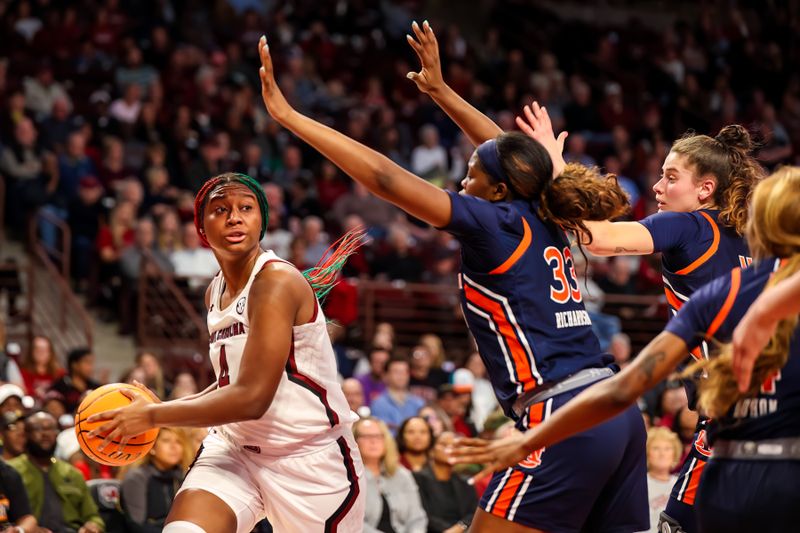 Jan 5, 2023; Columbia, South Carolina, USA; South Carolina Gamecocks forward Aliyah Boston (4) looks to pass around Auburn Tigers forward Kharyssa Richardson (33) in the first half at Colonial Life Arena. Mandatory Credit: Jeff Blake-USA TODAY Sports