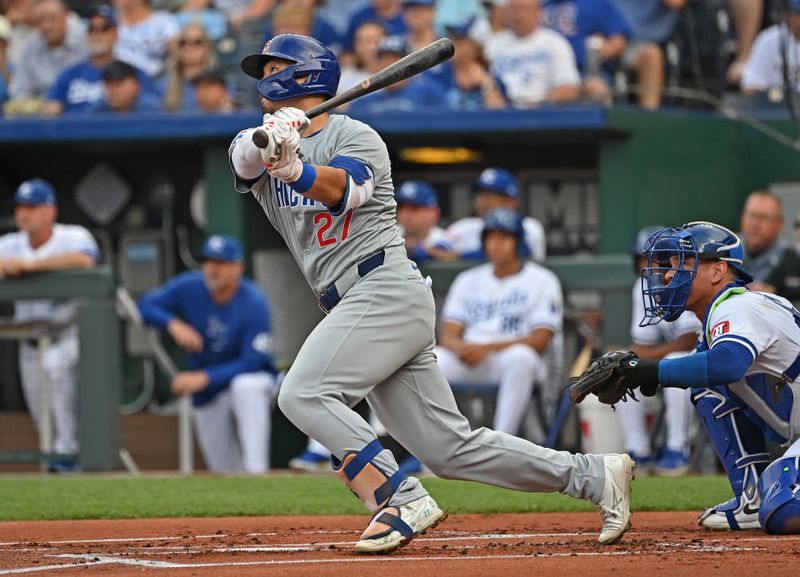 Jul 27, 2024; Kansas City, Missouri, USA;  Chicago Cubs right fielder Seiya Suzuki (27) hits a two-run home run in the first inning against the Kansas City Royals at Kauffman Stadium. Mandatory Credit: Peter Aiken-USA TODAY Sports