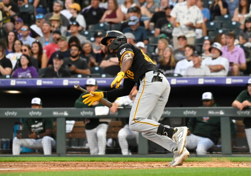 Jun 15, 2024; Denver, Colorado, USA; Pittsburgh Pirates outfielder Michael A. Taylor (18) hits a triple in the fifth inning against the Colorado Rockies at Coors Field. Mandatory Credit: John Leyba-USA TODAY Sports