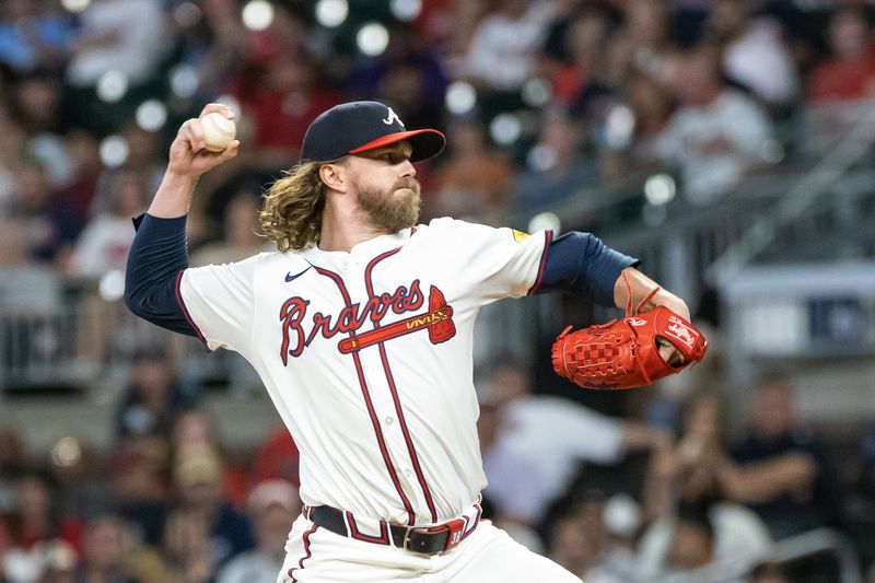 Aug 22, 2024; Cumberland, Georgia, USA; Atlanta Braves pitcher Pierce Johnson (38) pitches against the Philadelphia Phillies during the seventh inning at Truist Park. Mandatory Credit: Jordan Godfree-USA TODAY Sports