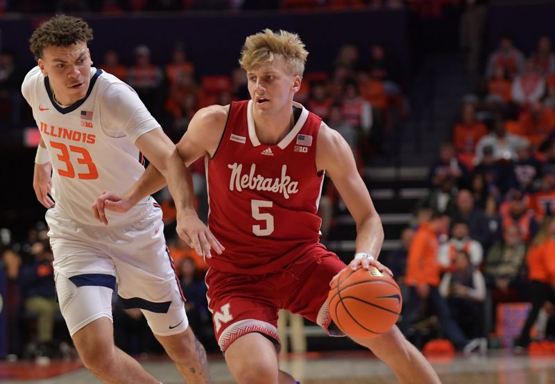 Jan 31, 2023; Champaign, Illinois, USA; Nebraska Cornhuskers guard Sam Griesel (5) drives the ball past Illinois Fighting Illini forward Coleman Hawkins (33) during the second half at State Farm Center. Mandatory Credit: Ron Johnson-USA TODAY Sports