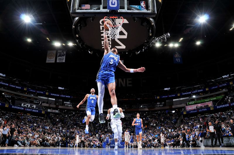 ORLANDO, FL - MARCH 29: Paolo Banchero #5 of the Orlando Magic drives to the basket during the game against the LA Clippers on March 29, 2024 at the Kia Center in Orlando, Florida. NOTE TO USER: User expressly acknowledges and agrees that, by downloading and or using this photograph, User is consenting to the terms and conditions of the Getty Images License Agreement. Mandatory Copyright Notice: Copyright 2024 NBAE (Photo by Fernando Medina/NBAE via Getty Images)