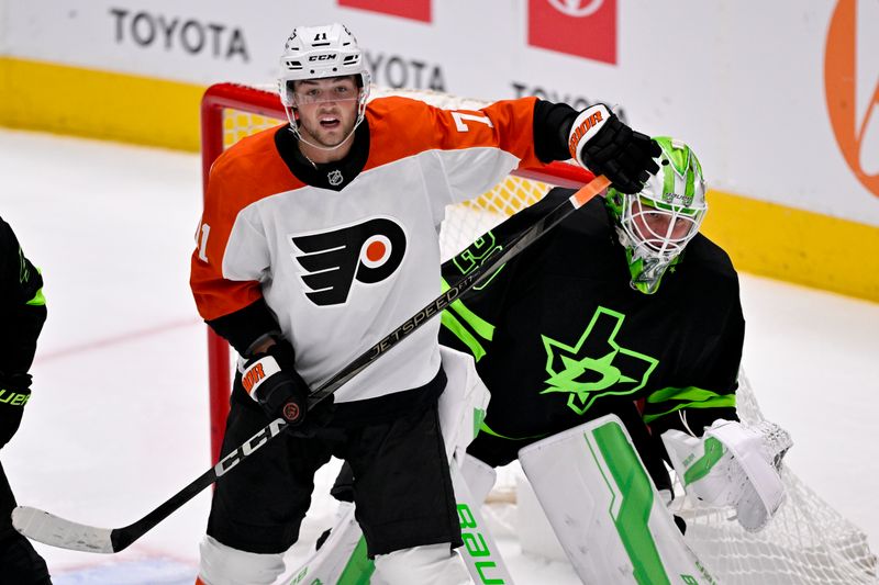 Mar 22, 2025; Dallas, Texas, USA; Philadelphia Flyers right wing Tyson Foerster (71) looks for the puck in front of Dallas Stars goaltender Jake Oettinger (29) during the third period at the American Airlines Center. Mandatory Credit: Jerome Miron-Imagn Images