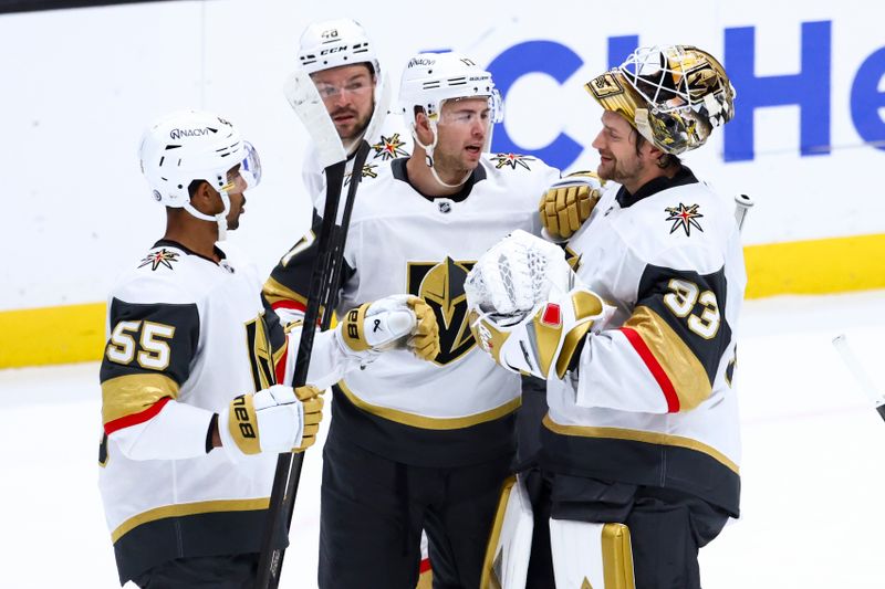 Nov 13, 2024; Anaheim, California, USA; Vegas Golden Knights defenseman Ben Hutton (17) celebrates with goaltender Adin Hill (33) after defeating the Anaheim Ducks during a hockey game at Honda Center. Mandatory Credit: Jessica Alcheh-Imagn Images