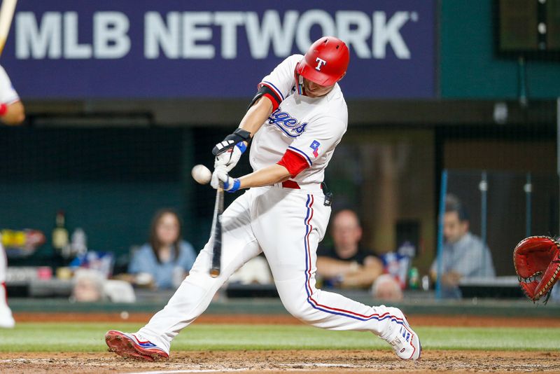 Jun 7, 2023; Arlington, Texas, USA; Texas Rangers shortstop Corey Seager (5) hits a double during the seventh inning against the St. Louis Cardinals at Globe Life Field. Mandatory Credit: Andrew Dieb-USA TODAY Sports