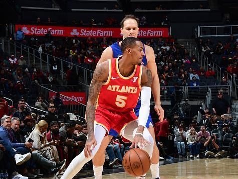 ATLANTA, GA - DECEMBER 18: Dejounte Murray #5 of the Atlanta Hawks handles the ball during the game  on December 18, 2023 at State Farm Arena in Atlanta, Georgia.  NOTE TO USER: User expressly acknowledges and agrees that, by downloading and/or using this Photograph, user is consenting to the terms and conditions of the Getty Images License Agreement. Mandatory Copyright Notice: Copyright 2023 NBAE (Photo by Scott Cunningham/NBAE via Getty Images)