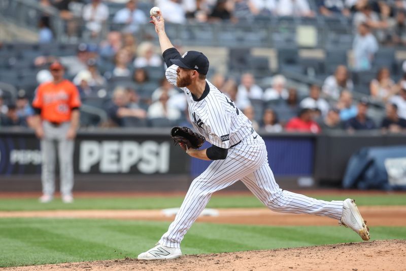 Sep 27, 2025; Bronx, New York, USA;  New York Yankees relief pitcher Paul Blackburn (58) pitches in the ninth inning against the Baltimore Orioles at Yankee Stadium. Mandatory Credit: Wendell Cruz-Imagn Images
