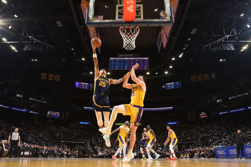 SAN FRANCISCO, CA - FEBRUARY 22:  Lester Quinones #25 of the Golden State Warriors goes to the basket during the game on February 22, 2024 at Chase Center in San Francisco, California. NOTE TO USER: User expressly acknowledges and agrees that, by downloading and or using this photograph, user is consenting to the terms and conditions of Getty Images License Agreement. Mandatory Copyright Notice: Copyright 2024 NBAE (Photo by Noah Graham/NBAE via Getty Images)