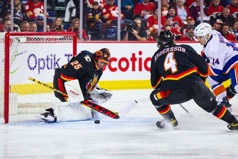 Nov 18, 2023; Calgary, Alberta, CAN; Calgary Flames goaltender Jacob Markstrom (25) makes a save against New York Islanders center Bo Horvat (14) during the first period at Scotiabank Saddledome. Mandatory Credit: Sergei Belski-USA TODAY Sports