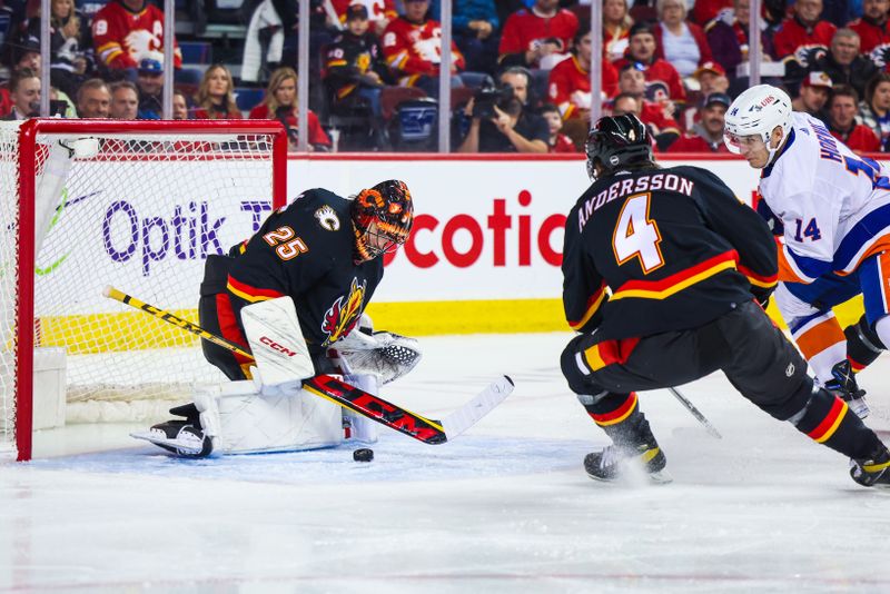 Nov 18, 2023; Calgary, Alberta, CAN; Calgary Flames goaltender Jacob Markstrom (25) makes a save against New York Islanders center Bo Horvat (14) during the first period at Scotiabank Saddledome. Mandatory Credit: Sergei Belski-USA TODAY Sports