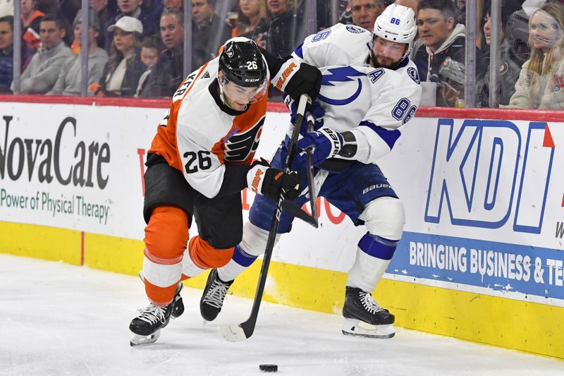 Feb 27, 2024; Philadelphia, Pennsylvania, USA; Philadelphia Flyers defenseman Sean Walker (26) and Tampa Bay Lightning right wing Nikita Kucherov (86) battle for the puck during the second period at Wells Fargo Center. Mandatory Credit: Eric Hartline-USA TODAY Sports