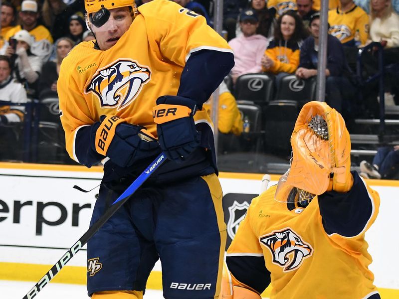 Dec 27, 2023; Nashville, Tennessee, USA; Nashville Predators defenseman Luke Schenn (2) blocks a shot during the second period against the Carolina Hurricanes at Bridgestone Arena. Mandatory Credit: Christopher Hanewinckel-USA TODAY Sports