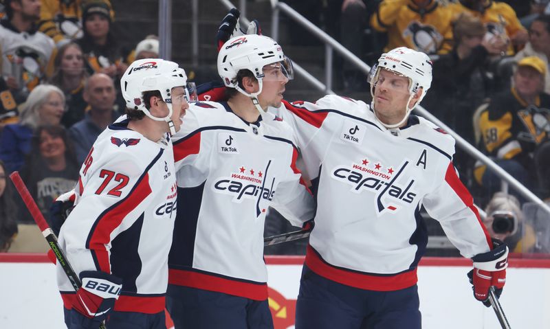 Nov 6, 2025; Pittsburgh, Pennsylvania, USA;  Washington Capitals left wing Anthony Beauvillier (72) and defenseman John Carlson (74) congratulate Washington Capitals center Dylan Strome (17) on his goal against the Pittsburgh Penguins during the second period at PPG Paints Arena. Mandatory Credit: Charles LeClaire-Imagn Images