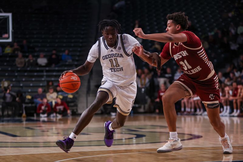 Jan 4, 2025; Atlanta, Georgia, USA; Georgia Tech Yellow Jackets forward Baye Ndongo (11) drives on Boston College Eagles forward Elijah Strong (31) in the second half at McCamish Pavilion. Mandatory Credit: Brett Davis-Imagn Images
