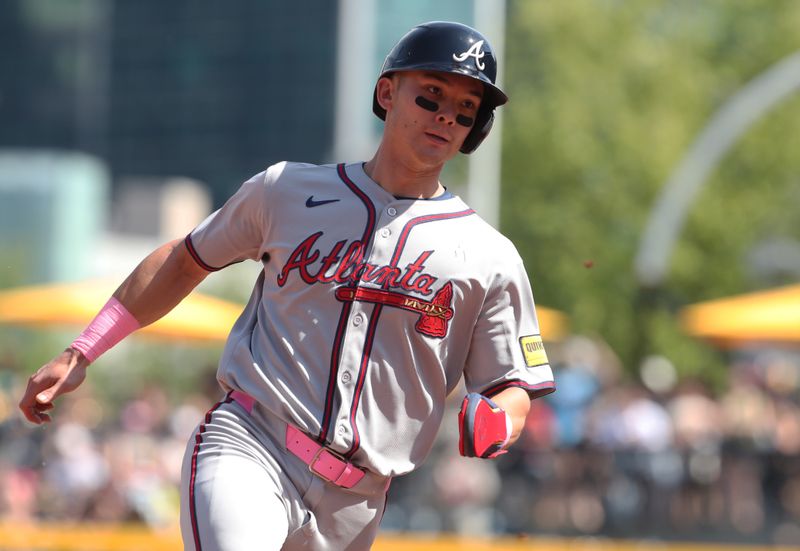 May 11, 2025; Pittsburgh, Pennsylvania, USA;  Atlanta Braves pinch runner Stuart Fairchild (17) runs on his way to scoring a run against the Pittsburgh Pirates during the eighth inning at PNC Park. Mandatory Credit: Charles LeClaire-Imagn Images