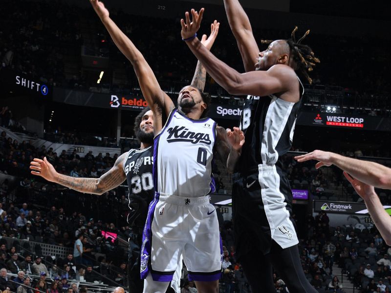 SAN ANTONIO, TX - DECEMBER 6: Malik Monk #0 of the Sacramento Kings drives to the basket during the game against the San Antonio Spurs on December 6, 2024 at the Frost Bank Center in San Antonio, Texas. NOTE TO USER: User expressly acknowledges and agrees that, by downloading and or using this photograph, user is consenting to the terms and conditions of the Getty Images License Agreement. Mandatory Copyright Notice: Copyright 2024 NBAE (Photos by Michael Gonzales/NBAE via Getty Images)