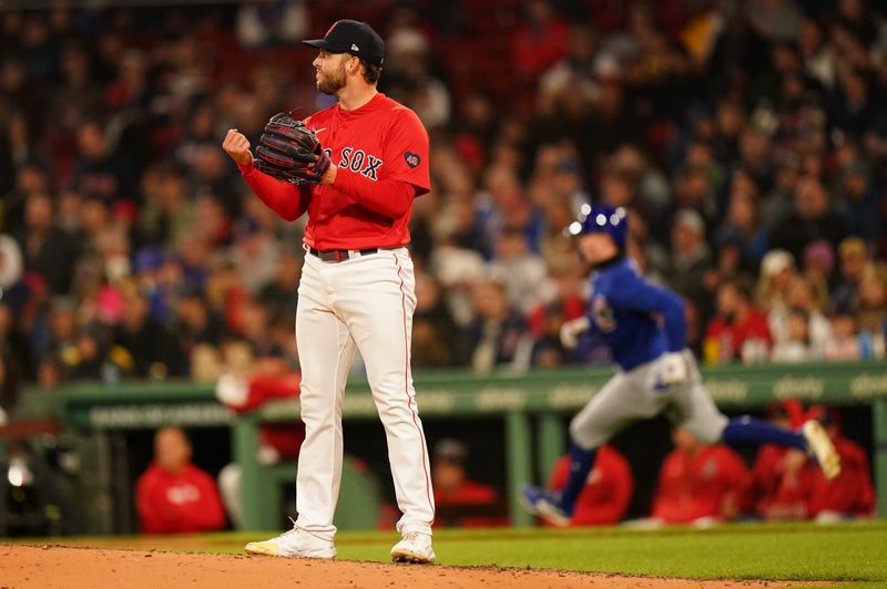 Apr 26, 2024; Boston, Massachusetts, USA; Boston Red Sox starting pitcher Kutter Crawford (50) reacts after Chicago Cubs center fielder Pete Crow-Armstrong (52) hits a single in the fifth inning at Fenway Park. Mandatory Credit: David Butler II-USA TODAY Sports