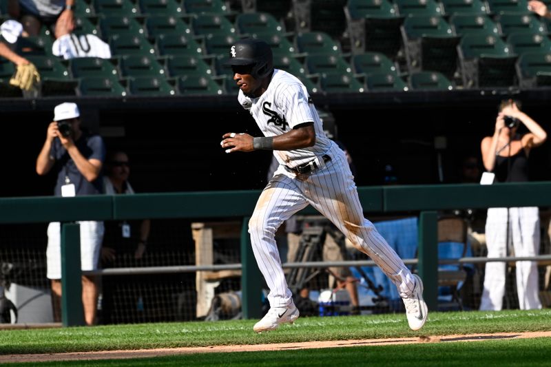 Aug 23, 2023; Chicago, Illinois, USA;  Chicago White Sox shortstop Tim Anderson (7) steals home plate to put the team ahead against the Seattle Mariners tenth inning at Guaranteed Rate Field. Mandatory Credit: Matt Marton-USA TODAY Sports