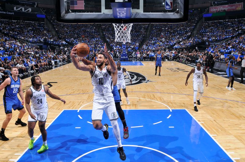 ORLANDO, FL - OCTOBER 25: Ben Simmons #10 of the Brooklyn Nets rebounds the ball during the game against the Orlando Magic  on October 25, 2024 at Kia Center in Orlando, Florida. NOTE TO USER: User expressly acknowledges and agrees that, by downloading and or using this photograph, User is consenting to the terms and conditions of the Getty Images License Agreement. Mandatory Copyright Notice: Copyright 2024 NBAE (Photo by Fernando Medina/NBAE via Getty Images)