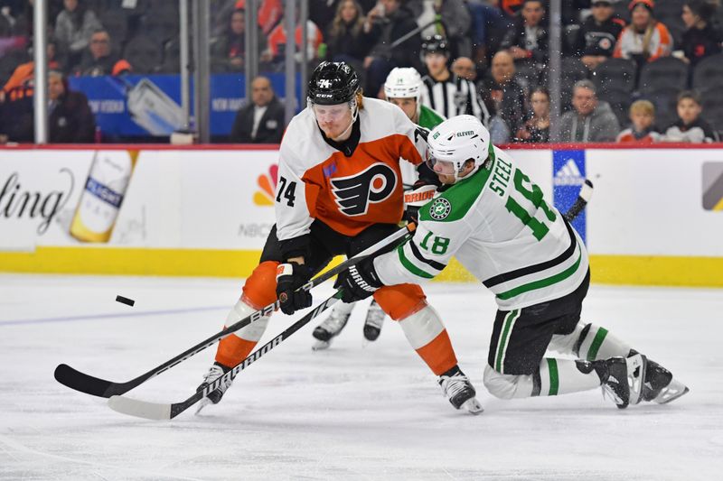 Jan 18, 2024; Philadelphia, Pennsylvania, USA; Philadelphia Flyers right wing Owen Tippett (74) and Dallas Stars center Sam Steel (18) battle for the puck during the first period at Wells Fargo Center. Mandatory Credit: Eric Hartline-USA TODAY Sports