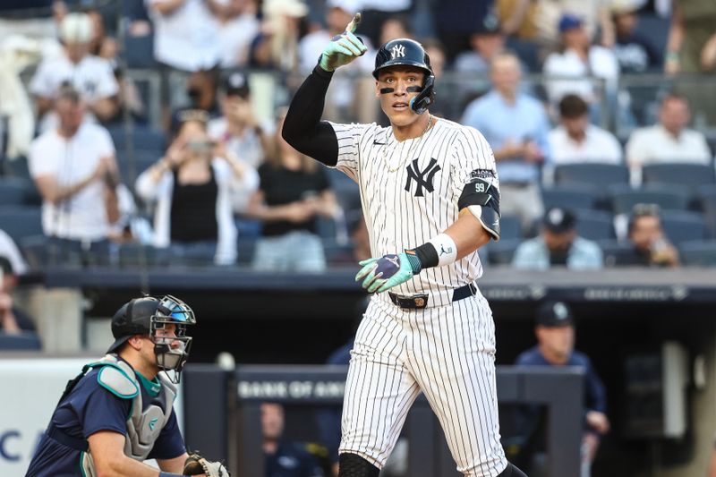 May 22, 2024; Bronx, New York, USA;  New York Yankees center fielder Aaron Judge (99) gestures after hitting a two run home run in the first inning against the Seattle Mariners at Yankee Stadium. Mandatory Credit: Wendell Cruz-USA TODAY Sports