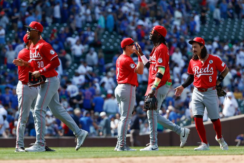 Jun 2, 2024; Chicago, Illinois, USA; Cincinnati Reds players celebrate after defeating the Chicago Cubs in a baseball game at Wrigley Field. Mandatory Credit: Kamil Krzaczynski-USA TODAY Sports