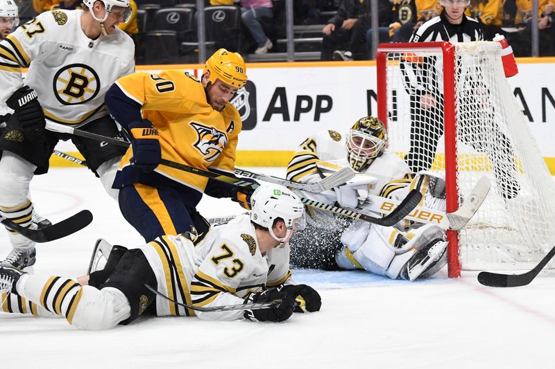 Apr 2, 2024; Nashville, Tennessee, USA; Boston Bruins goaltender Linus Ullmark (35) watches the puck after a save against Nashville Predators center Ryan O'Reilly (90) during the third period at Bridgestone Arena. Mandatory Credit: Christopher Hanewinckel-USA TODAY Sports