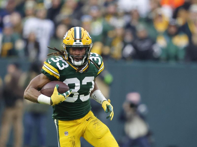 Green Bay Packers running back Aaron Jones (33) runs the ball during an NFL football game against the Chicago Bears Sunday, Jan. 7, 2024, in Green Bay, Wis. (AP Photo/Jeffrey Phelps