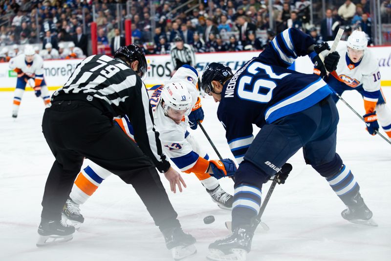 Jan 16, 2024; Winnipeg, Manitoba, CAN; New York Islanders forward Mathew Barzal (13) faces off against Winnipeg Jets forward Nino Niederreiter (62) during the first period at Canada Life Centre. Mandatory Credit: Terrence Lee-USA TODAY Sports