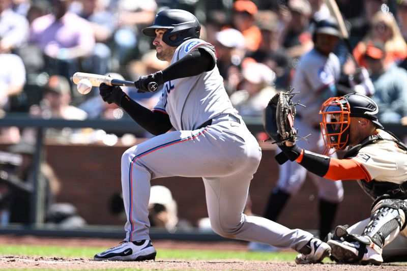 Jun 26, 2025; San Francisco, California, USA; Miami Marlins catcher Nick Fortes (4) bunts against the San Francisco Giants in the eighth inning at Oracle Park. Mandatory Credit: Eakin Howard-Imagn Images