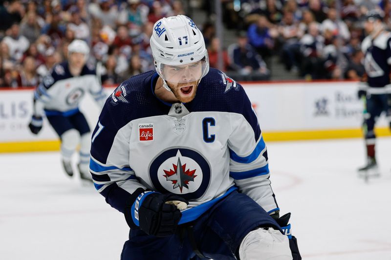 Apr 13, 2024; Denver, Colorado, USA; Winnipeg Jets center Adam Lowry (17) celebrates his goal in the first period against the Colorado Avalanche at Ball Arena. Mandatory Credit: Isaiah J. Downing-USA TODAY Sports