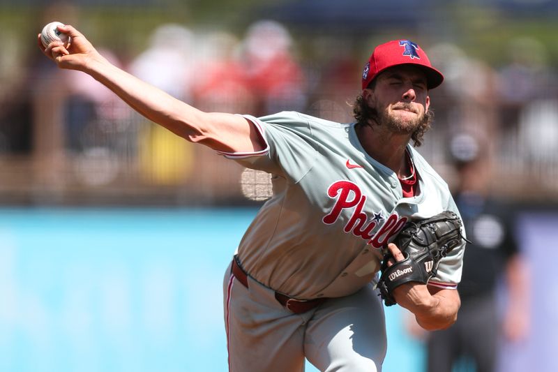 Mar 7, 2024; Port Charlotte, Florida, USA;  Philadelphia Phillies starting pitcher Aaron Nola (27) throws a pitch against the Tampa Bay Rays in the second inning at Charlotte Sports Park. Mandatory Credit: Nathan Ray Seebeck-USA TODAY Sports